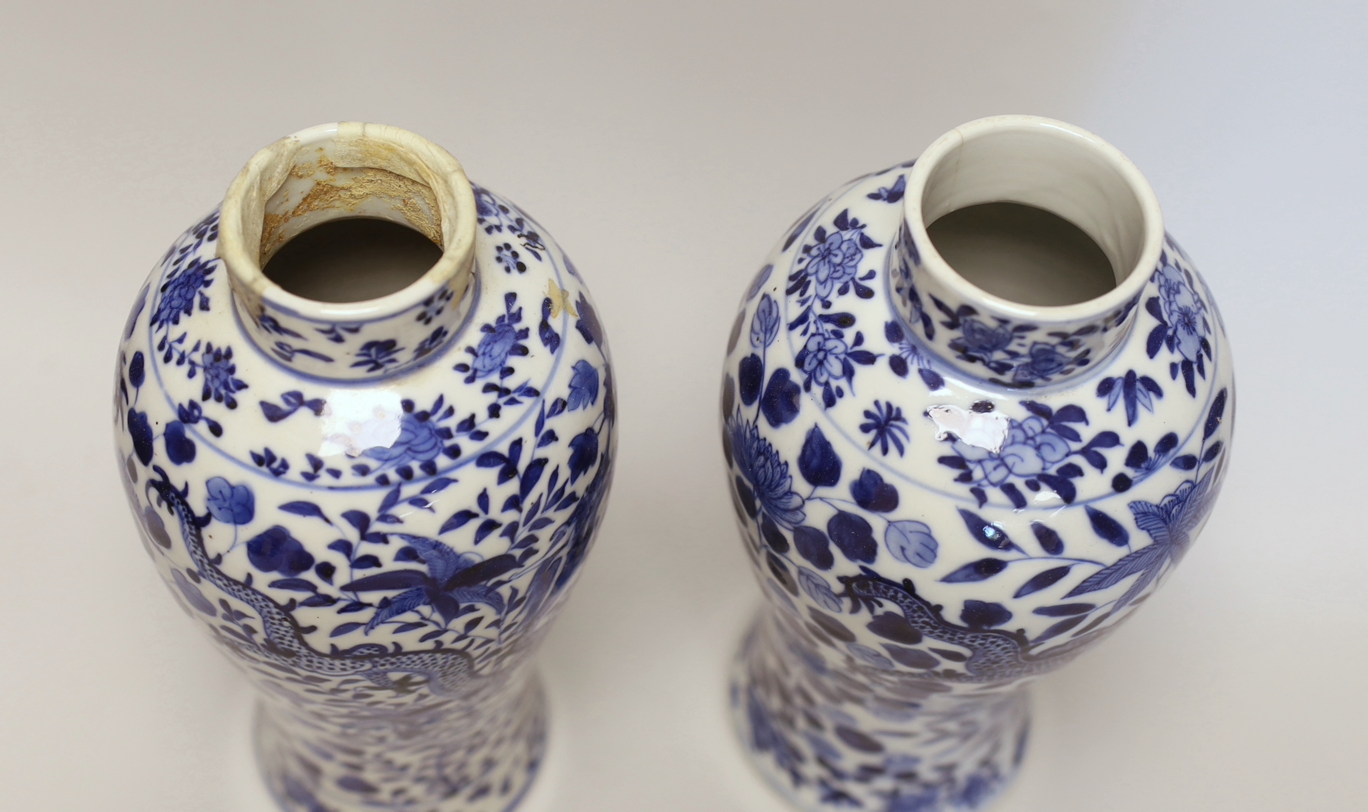 A pair of Chinese blue and white 'dragon’ vases and covers, Late 19th century, 29cm high